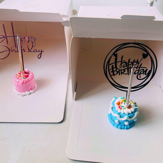 April fool’s day mini cake in a big box